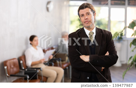 Portrait of confident senior male director in office Portrait of confident senior male director in office 139477987