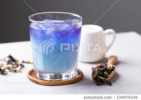 Iced butterfly pea tea with milk in glass, a healthy herbal drink 139479156