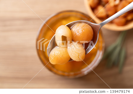 Close-up of dried longan in spoon, longan juice Close-up of dried longan in spoon, longan juice 139479174