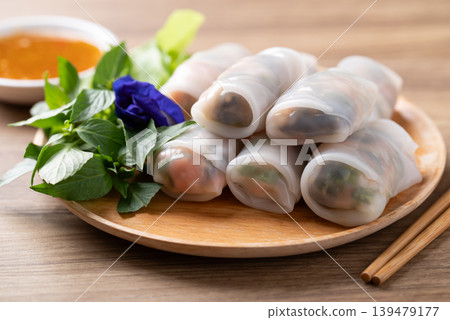 Thai Fresh Spring Rolls with Herbs and Vegetables eating with spicy dipping sauce Thai Fresh Spring Rolls with Herbs and Vegetables eating with spicy dipping sauce 139479177