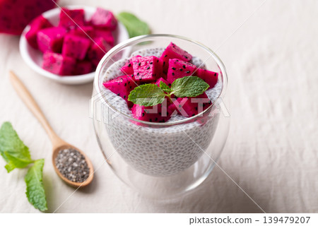 Chia pudding topped with fresh dragon fruit in a glass, Healthy eating Chia pudding topped with fresh dragon fruit in a glass, Healthy eating 139479207