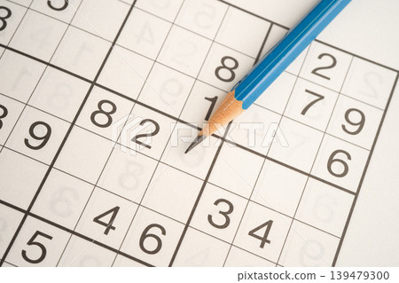 Sudoku puzzle game playing to challenge brain. Sudoku puzzle game playing to challenge brain. 139479300