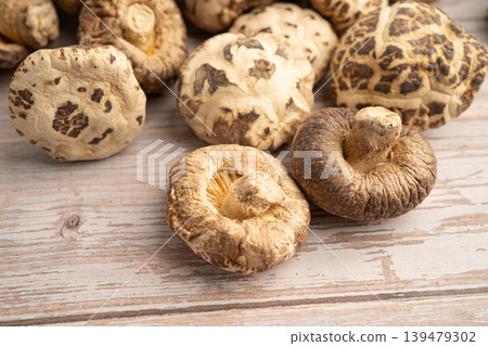 Dried shiitake mushroom on wooden background. healthy food. 139479302
