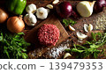 Preparing raw ground beef patties with fresh ingredients and spices 139479353