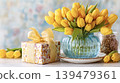 Yellow tulips in vase with gift box celebrating spring 139479361