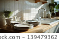 Sun shining on stack of clean white plates in kitchen 139479362