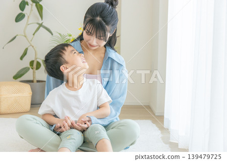 Parents and children relaxing in the living room Parents and children relaxing in the living room 139479725