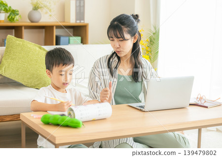 Moms and children working remotely Moms and children working remotely 139479802