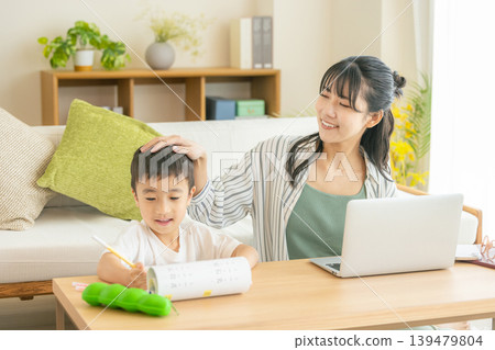 Moms and children working remotely Moms and children working remotely 139479804