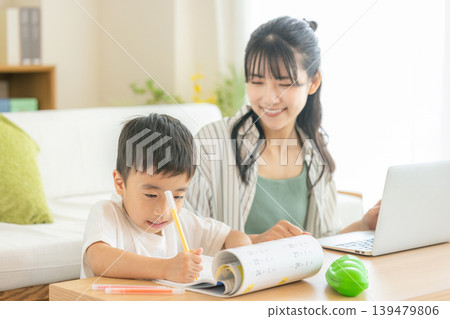 Moms and children working remotely Moms and children working remotely 139479806