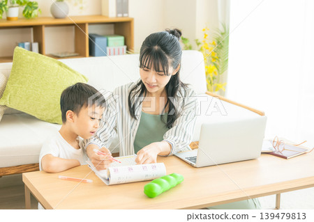 Moms and children working remotely Moms and children working remotely 139479813