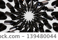 Abstract 3D render of black glossy cosmetic bottles arranged in a circular pattern with dynamic motion blur effect on dark background. 139480044