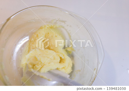 Making choux pastry by mixing melted butter and flour. 139481030