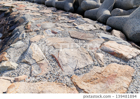 A stone-reinforced pier on the coast A stone-reinforced pier on the coast 139481894