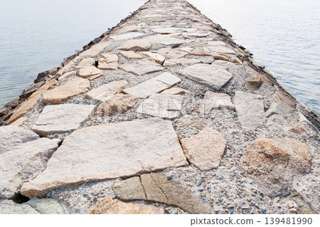 A stone-reinforced pier on the coast A stone-reinforced pier on the coast 139481990