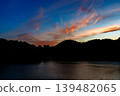 A beautiful sunset over the Nara Nunome Dam, filled to capacity; sunset clouds coloring the sky during the beautiful blue hour ④ 139482065