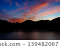 A beautiful sunset over the Nara Nunome Dam, filled to capacity; sunset clouds coloring the sky during the beautiful blue hour. ⑥ 139482067