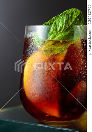Cocktail with lemon, ice and mint in misted glass. Cocktail with lemon, ice and mint in misted glass. 139482792
