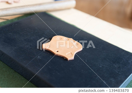 Photo of leather stamped with an embossed design. Photo of leather stamped with an embossed design. 139483870