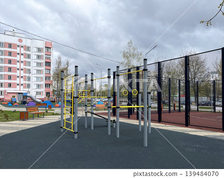 Outdoor street workout and playground equipment in residential area Outdoor street workout and playground equipment in residential area 139484070
