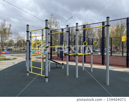 Outdoor street workout and playground equipment in residential area 139484071