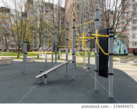 Outdoor street workout and playground equipment in residential area Outdoor street workout and playground equipment in residential area 139484072