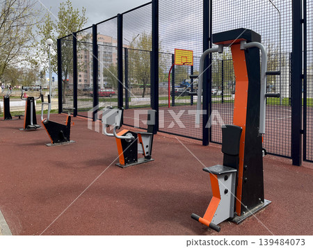 Outdoor gym equipment on sports ground in residential area 139484073