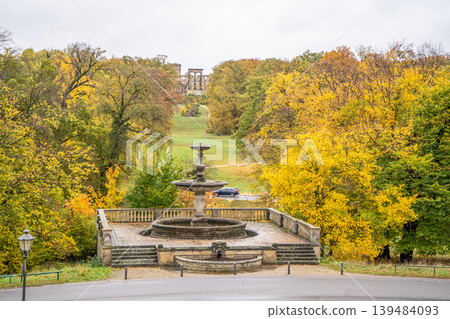 Fountain in the autumn park Sanssouci Palace Potsdam, Germany. Nature garden yellow trees. Fountain in the autumn park Sanssouci Palace Potsdam, Germany. Nature garden yellow trees. 139484093