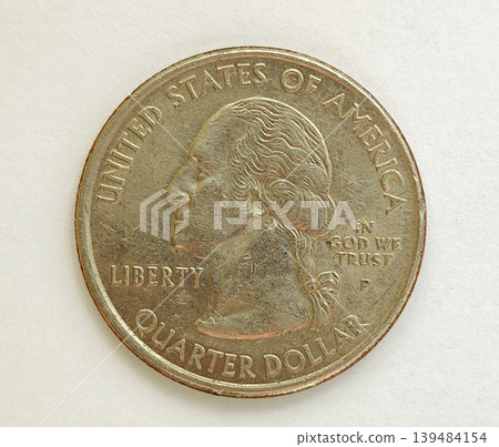A quarter dollar coin on a white isolated background. George Washington's profile 139484154