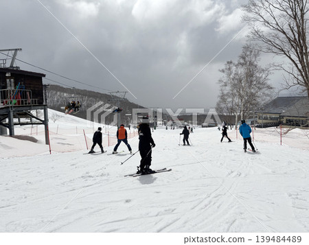 Niseko, Japan - April 3, 2025 : Snowboarders and skiers enjoy activities at Annupuri ski resort, Niseko, Hokkaido, Japan on April 3, 2025. 139484489