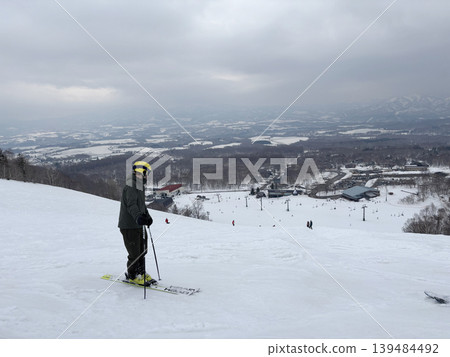 Niseko, Japan - April 3, 2025 : Snowboarders and skiers enjoy activities at Annupuri ski resort, Niseko, Hokkaido, Japan on April 3, 2025. Niseko, Japan - April 3, 2025 : Snowboarders and skiers enjoy activities at Annupuri ski resort, Niseko, Hokkaido, Japan on April 3, 2025. 139484492