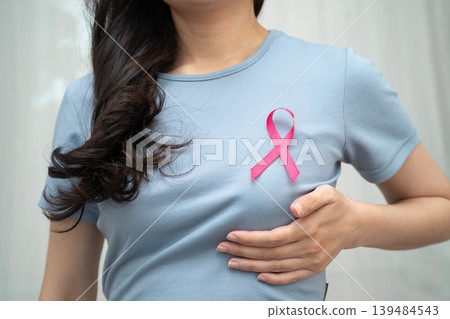 Asian woman with pink ribbon, World Breast Cancer Day at October. 139484543