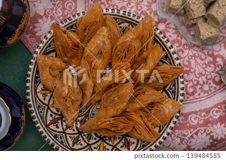 Crimean Tatar Baklava, a traditional pastry in bowl. Sweet diamond shapes food Crimean Tatar Baklava, a traditional pastry in bowl. Sweet diamond shapes food 139484585