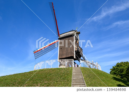 Traditional wooden windmill in Medieval Old Town and UNESCO World Culture Heritage site of Bruges in West Flanders, Belgium Traditional wooden windmill in Medieval Old Town and UNESCO World Culture Heritage site of Bruges in West Flanders, Belgium 139484698