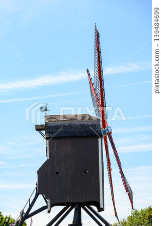 Traditional wooden windmill in Medieval Old Town and UNESCO World Culture Heritage site of Bruges in West Flanders, Belgium Traditional wooden windmill in Medieval Old Town and UNESCO World Culture Heritage site of Bruges in West Flanders, Belgium 139484699