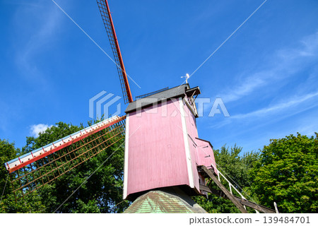 Traditional wooden windmill in Medieval Old Town and UNESCO World Culture Heritage site of Bruges in West Flanders, Belgium Traditional wooden windmill in Medieval Old Town and UNESCO World Culture Heritage site of Bruges in West Flanders, Belgium 139484701