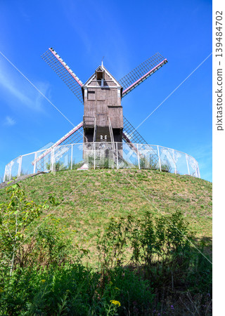 Traditional wooden windmill in Medieval Old Town and UNESCO World Culture Heritage site of Bruges in West Flanders, Belgium Traditional wooden windmill in Medieval Old Town and UNESCO World Culture Heritage site of Bruges in West Flanders, Belgium 139484702