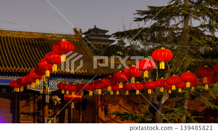 Red lanterns at the entrance to Jingshan park in Beijing, China at night Red lanterns at the entrance to Jingshan park in Beijing, China at night 139485821