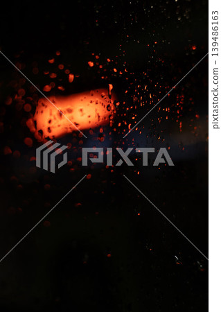 Rain on Window at Night with Blurred City red Light. Vertical, mobile format. Rain on Window at Night with Blurred City red Light. Vertical, mobile format. 139486163