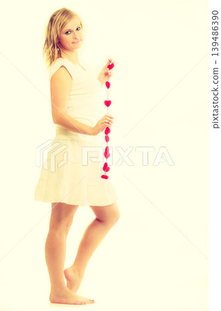 Girl with little red hearts. Girl with little red hearts. 139486390
