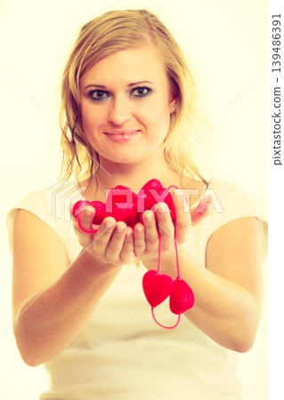Girl with little red hearts. Girl with little red hearts. 139486391