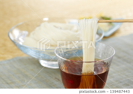 A classic Japanese summer noodle dish: cold somen noodles A classic Japanese summer noodle dish: cold somen noodles 139487443