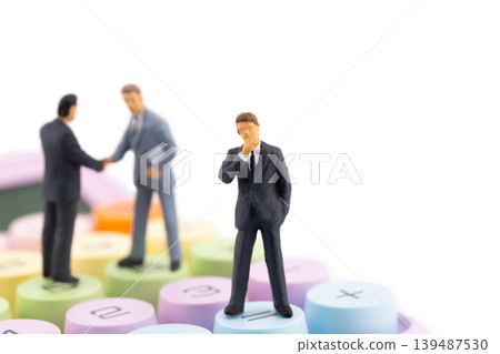 Miniature businessman thinking on equal button with handshake on calculator for business success and financial result Miniature businessman thinking on equal button with handshake on calculator for business success and financial result 139487530