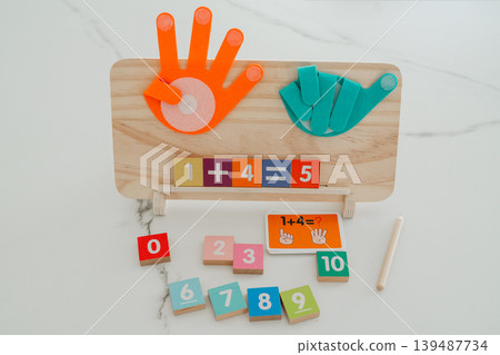 Math board showing a completed addition equation. Helps children understand results and reinforces basic arithmetic skills. Math board showing a completed addition equation. Helps children understand results and reinforces basic arithmetic skills. 139487734