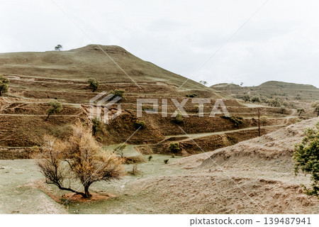 Landscape of Dagestan mountains, mountain range in haze summer Russia Landscape of Dagestan mountains, mountain range in haze summer Russia 139487941