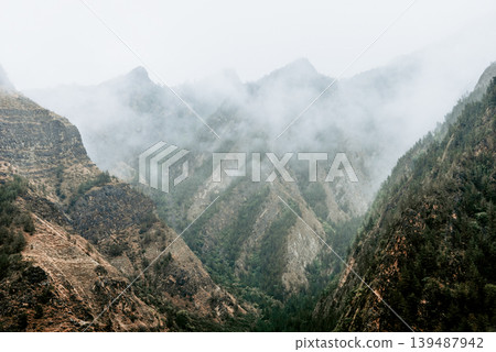 Landscape of Dagestan mountains, mountain range in haze summer Russia 139487942