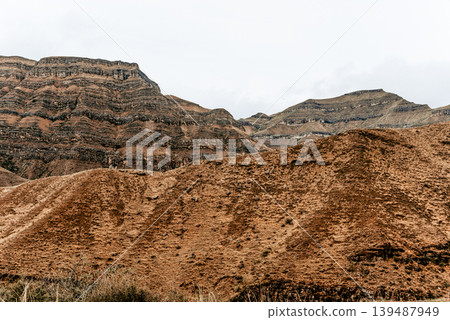 Landscape of Dagestan mountains, mountain range in haze summer Russia Landscape of Dagestan mountains, mountain range in haze summer Russia 139487949