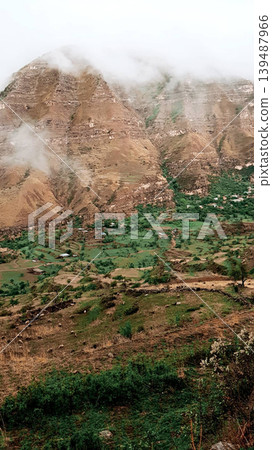 Landscape of Dagestan mountains, mountain range in haze summer Russia Landscape of Dagestan mountains, mountain range in haze summer Russia 139487966