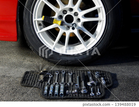 Car wheel and set of mounting and adjustment tools stock photo 139488019