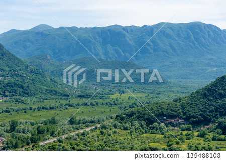 Landscape of Montenegro mountains Rijeka Crnojevia, hill peak range haze summer Landscape of Montenegro mountains Rijeka Crnojevia, hill peak range haze summer 139488108